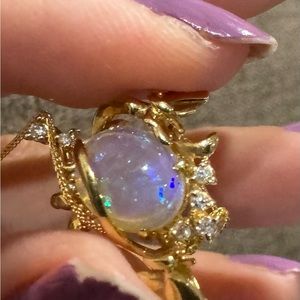 Stunning natural Opal and diamonds on 18k yellow gold necklace.